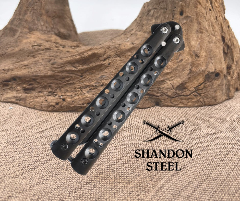 Black metal bracelet with engraved design on a textured surface, Primemartshop logo visible