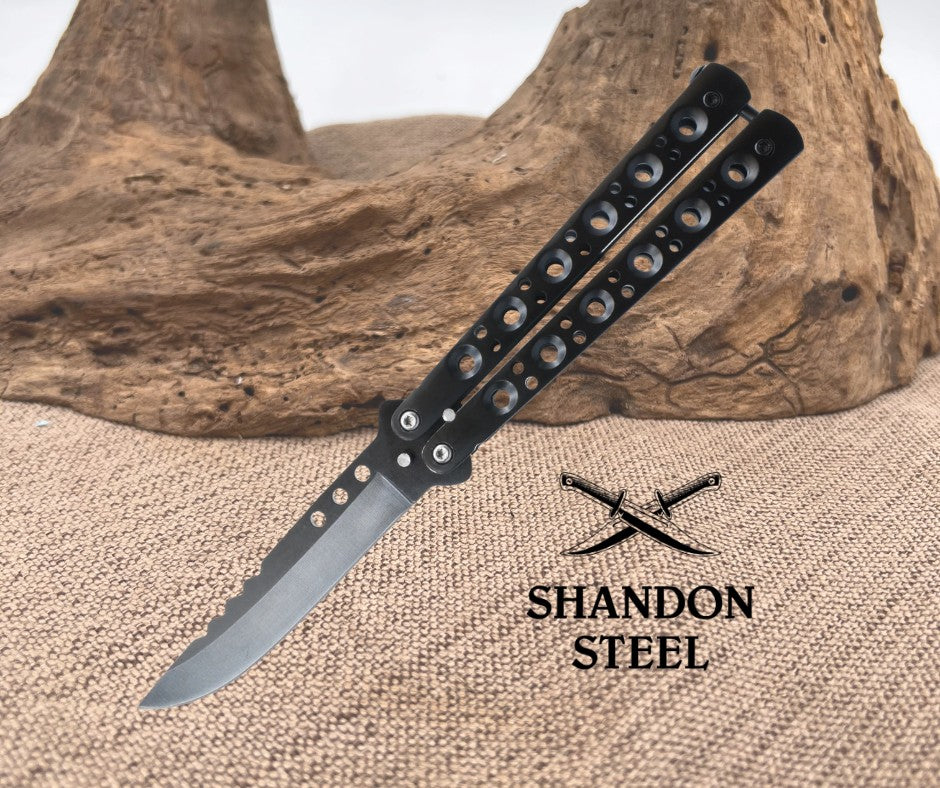 Folding knife with 'Shandon Steel' branding on a textured surface with wooden background