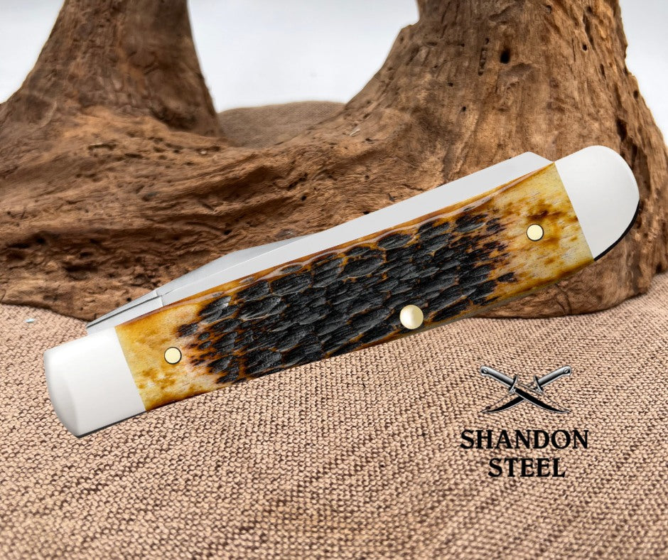 CASE XX Rogers Jigged Burnt Amber Bone CS Mini Trapper 51391