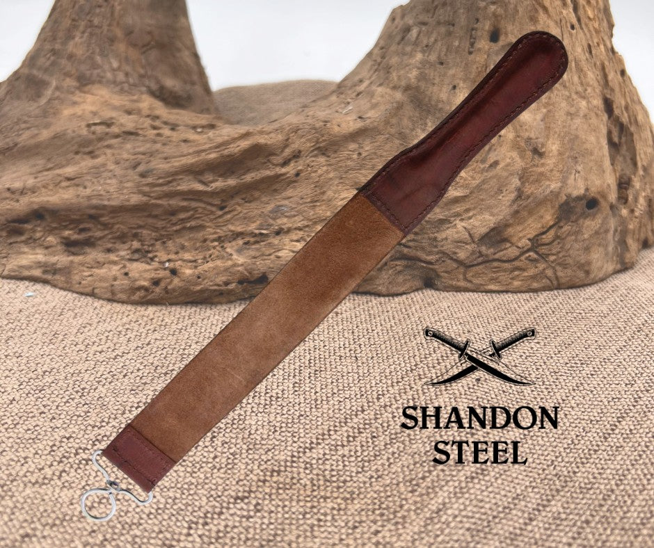 Brown leather knife sheath on a textured surface with 'Shandon Steel' branding.